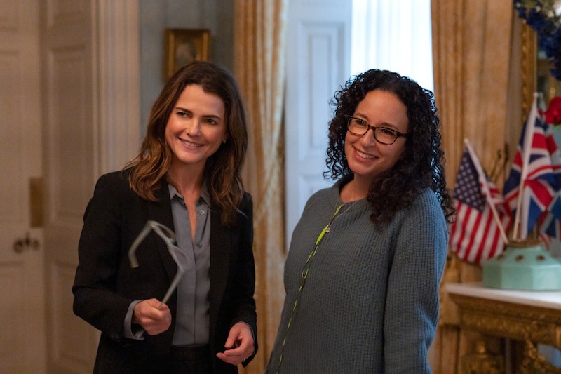 Keri Russell as Kate Wyler and Showrunner Debora Cahn in a behind the scenes photo in an office.