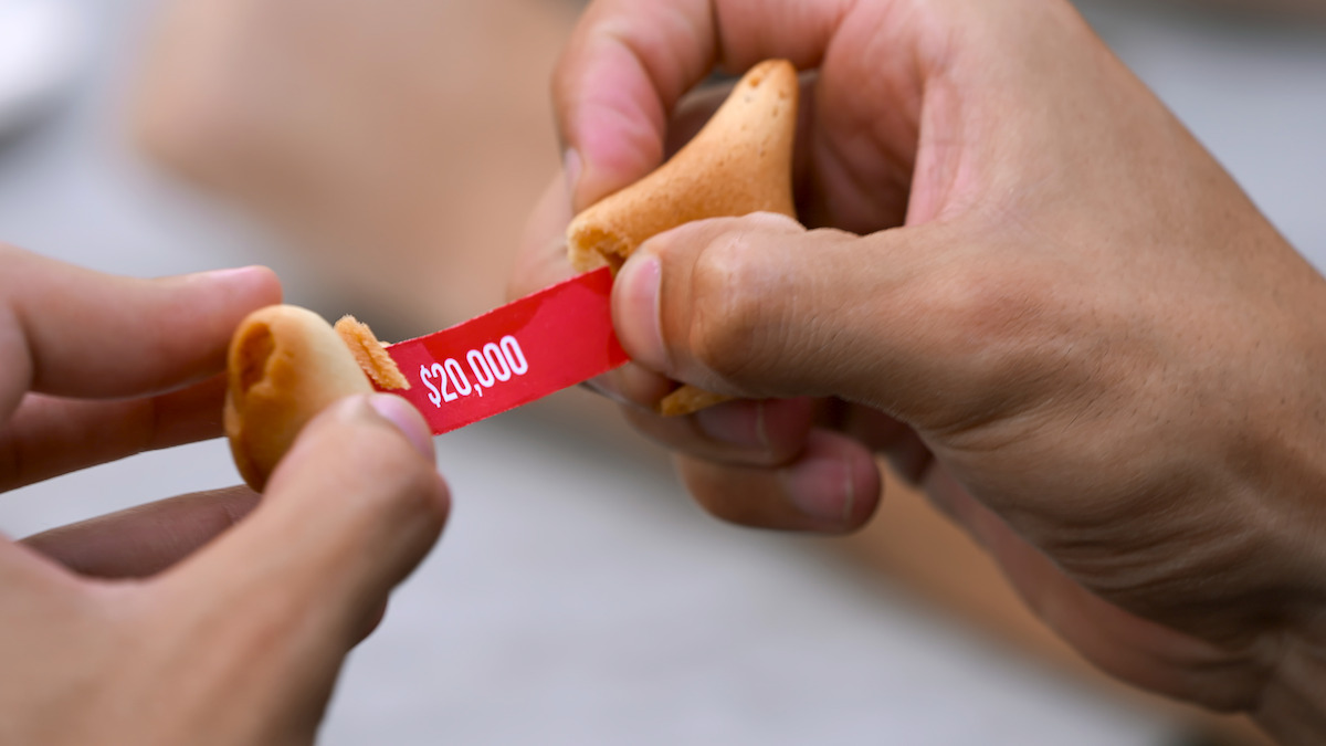 A fortune cookie reads ‘$20,000’.