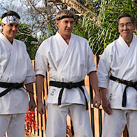 Cobra Kai senseis wear black belts and white karate uniforms in Season 6 of 'Cobra Kai'