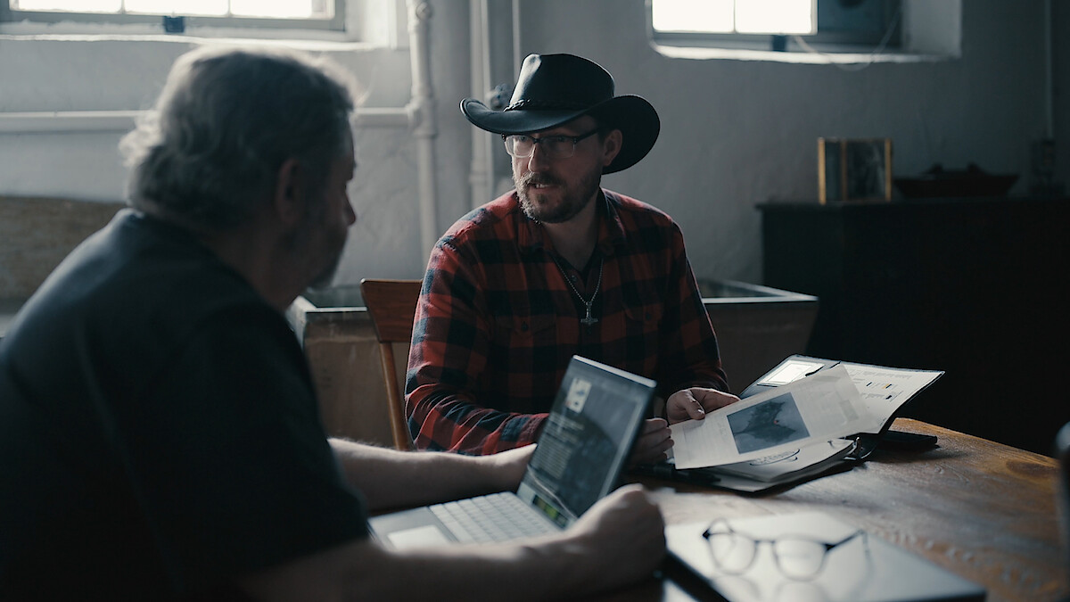 Lon Strickler and Tobias Wayland sitting at a table.