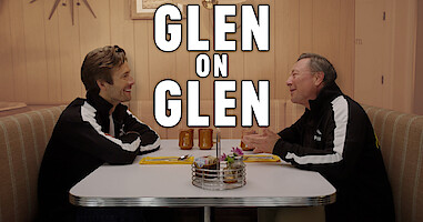 Glen Powell, left, sitting in a diner booth across from his father, Glen Powell Sr.