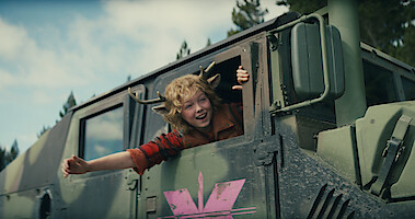 Christian Convery as Gus leans out of a tank smiling in Season 3 of 'Sweet Tooth'