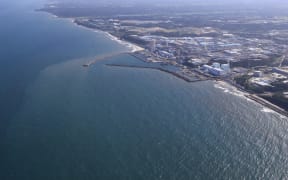 An aerial photo shows the Fukushima No.1 nuclear power plant of Tokyo Electric Power Company Holdings, Incorporated (TEPCO) in Fukushima Prefecture on August 24, 2023. TEPCO announced that Fukushima Daiichi nuclear power plant had started to release treated water stored within the premises of the plant into the ocean on the same day.( The Yomiuri Shimbun ) (Photo by Takuya Matsumoto / Yomiuri / The Yomiuri Shimbun via AFP)