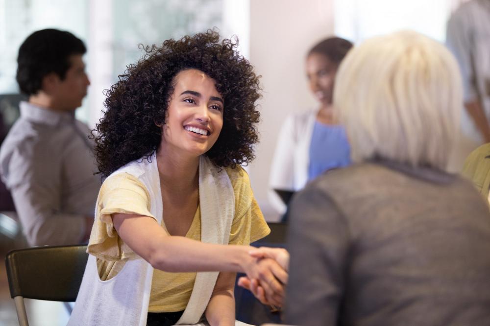 Colleagues shaking hands at work