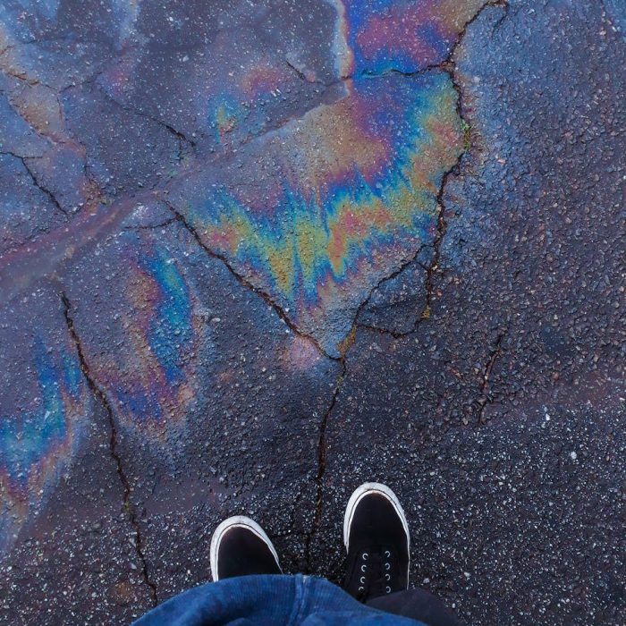 high angle photo of person standing on road