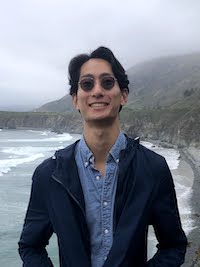 Hunter next to a cliff on the Big Sur