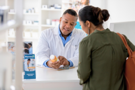 Pharmacist speaking with patient