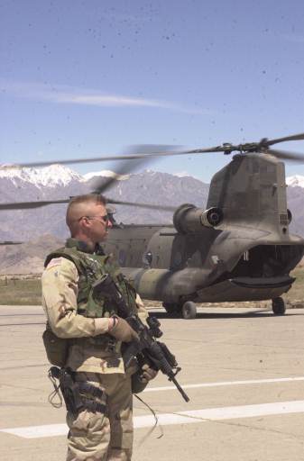 Soldier in front of Helicopter