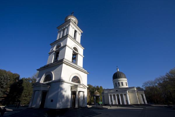 Picture of Nativity cathedral (Moldova): White belfry and Nativity Cathedral in Cathedral Park in the early morning