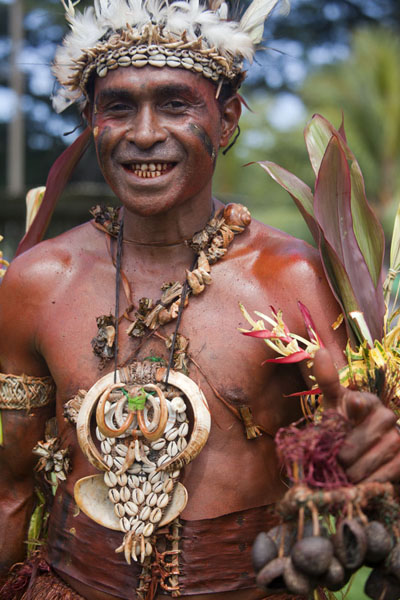 Picture of Madang festival (Papua New Guinea): Man with boar tusks from the Boroi region in the north of Madang province posing for a picture