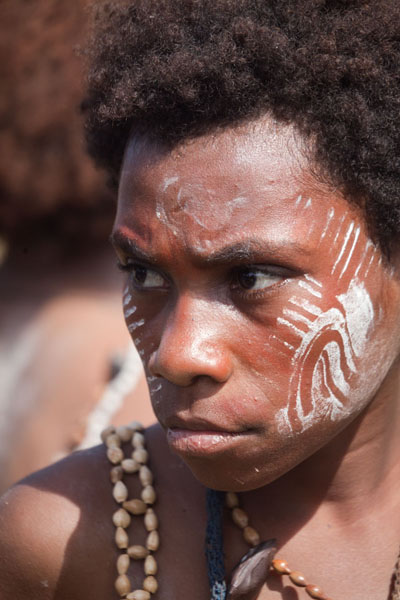 Picture of Madang festival (Papua New Guinea): Girl with facial painting in the singsing group from Kambaramba