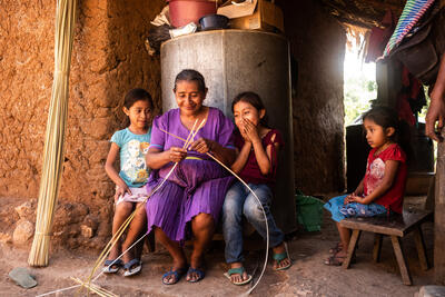 A grandmother with her two grandchildren