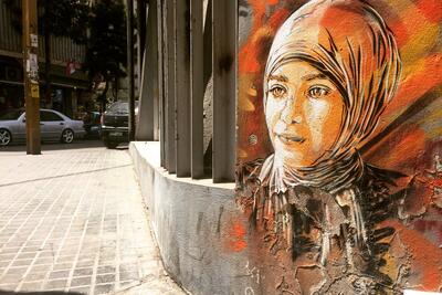 Painting of a refugee on a wall in Beirut