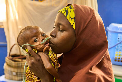 Falmata Goni and her baby at a stabilization centre managed by International Rescue Committee in Bama local government area, Borno State. 2 May 2023. The centre is supported by OCHA. Photo: OCHA/Adedeji Ademigbuji