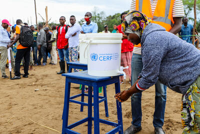 A woman in the Kigaramango IDP camp, Burundi, uses a handwashing station provided by the UN Central Emergency Response Fund (CERF). 