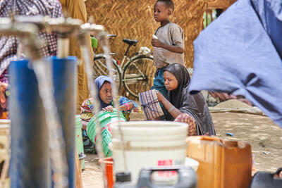 Girls gathering water at a water point in the General Hospital IDP camp in Bama, Borno State, Nigeria.