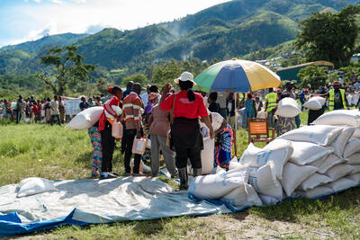  People line up to receive food and supplies in Kalehe, South Kivu, DR Congo, during a joint visit by the Pooled Fund and the Embassy of Sweden.