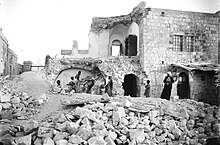 This is the Russian Monastery of Ascension on the Mount of Olives in which three people were killed. On the iron gate on the left, we can read Русская Духовная Миссия ('Russian Ecclesiastical Mission')