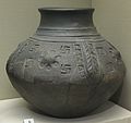 Early Anglo-Saxon cinerary urn with swastika motifs