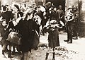 Image 7 Warsaw Ghetto Uprising Photo credit: USHMM Jews captured by SS and SD troops during the suppression of the Warsaw Ghetto Uprising are forced to leave their shelter and march to the Umschlagplatz for deportation. The SD trooper pictured second from the right, is Josef Blösche, who was identified by Polish authorities using this photograph. Blösche was tried for war crimes in Erfurt, East Germany in 1969, sentenced to death and executed in July of that year. More featured pictures