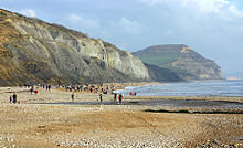 Cliffs in the distance, seashore in the foreground