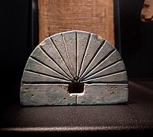 image of an Ancient Egyptian sundial (an engraved a semicircular-shaped rock