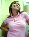 Image 82Woman wearing a polo shirt with a popped collar. (from 1990s in fashion)