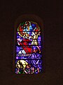 Stained glass window depicting the martyrdom of Saint Stephen