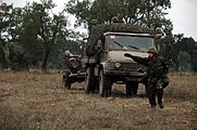 Portuguese Army Unimog towing a L118 light gun.