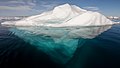 Image 13 Iceberg Photograph credit: Andreas Weith An iceberg is a large piece of freshwater ice that has broken off a glacier or an ice shelf and is floating freely in the open sea. Because the sea around this iceberg is so calm, the underwater portion is visible through the clear water. The largest iceberg ever detected was B-15, which split from the Ross Ice Shelf in Antarctica in 2000, and had a flat top; it had a surface area of 11,000 km2 (4,200 sq mi) and broke into several pieces in 2002 and 2003. This picture depicts an irregularly shaped iceberg with a rounded top, calved from a glacier in the Arctic and photographed in the Arctic Ocean north of Svalbard.