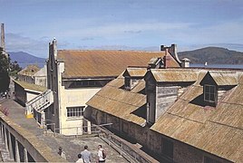 School House (two story building in the middle) and the Electric Repair shop (foreground) built in 1930s.