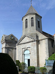 The war memorial and the church of Saint-Sylvain, in Ahun