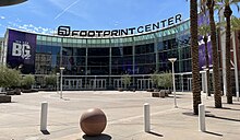 photo showing the semi-circular entrance to the Footprint Center in downtown Phoenix, blue sky in background