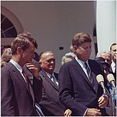 Attorney General Robert F. Kennedy and President John F. Kennedy are pictured speaking at the White House