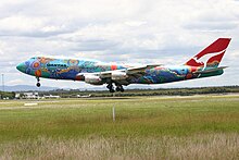 A Boeing 747-300 in 2004 wearing the Nalanji Dreaming livery. The aircraft carried the colour scheme from 1995 to 2005.