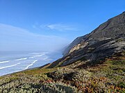 Coastal bluffs facing the pacific, photographed from a trail in Mussel Rock Park.