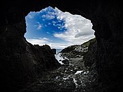 Low tide inside Tobin's Tunnel, a man-made stone tunnel near Mussel Rock.[17] [18]