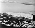 Image 100An iceberg being pushed out of a shipping lane by (L to R) USS Burton Island, USS Atka, and USS Glacier near McMurdo Station, Antarctica, 1965 (from Southern Ocean)