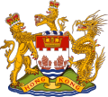 A golden Chinese dragon supported the colonial arms of Hong Kong to the right until its abandonment in 1997.