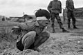 Squatting used as part of a stress position for a Viet Cong prisoner.