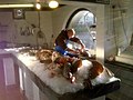 Fishmonger filleting a pollock