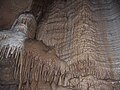 Image 39A flowstone formation inside Chimney Dome, part of Illinois Caverns in Monroe County. The cave is formed in limestone and dolomite by water dissolution and features stalactites, stalagmites, rimstone dams, flowstone, and soda straws. Photo credit: A. Frierdich (from Portal:Illinois/Selected picture)