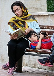 The PlayStation Portable had a lasting impact in a number of underserved markets. Here an Iranian can be seen playing a PSP while waiting in 2018.