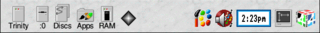 Screenshot of the icon bar under RISC OS 4 showing the following: Left portion, from left – Discs (in this case a hard disc and floppy disc), OmniClient (Network Filer), Apps folder (Resources:$.Apps), RamFS, Recycle bin, Right portion, from right – Task Manager, Display Manager, Alarm, Paint