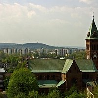 The church with the mound in the background