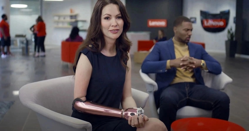 A lady and man sitting in the Lenovo office lobby