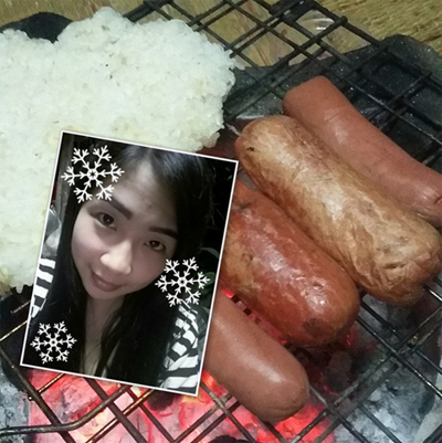 Girl takes selfie with a mouthwatering barbeque