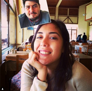 Young girl and boy take selfie at a cafe