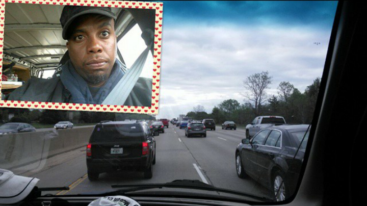 Young guy takes selfie while driving