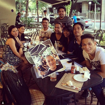 Group selfie in a cafe